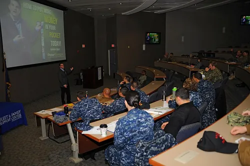 Peter Bielagus, a motivational financial educator, speaks to Sailors during a command leadership forum event in support of Military Saves we