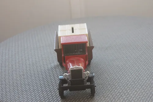 A Model 1925 Kenworth with Watkins Products Markings used as a collectible piggy bank. Seen from front.