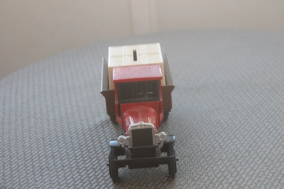 A Model 1925 Kenworth with Watkins Products Markings used as a collectible piggy bank. Seen from front.