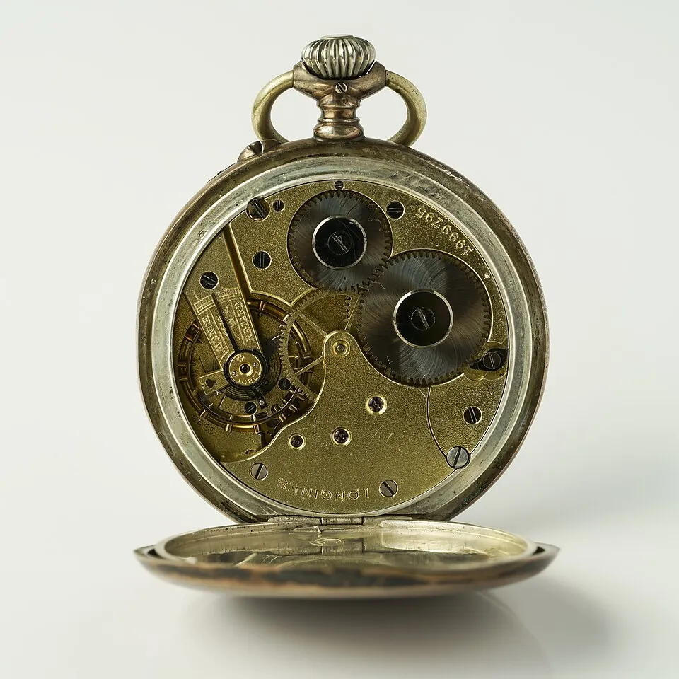 Longines manual winding pocket watch, model 4 Grand Prix, silver casing, manufactured approx. 1900. Rear view, wear marks, clockwork visibl