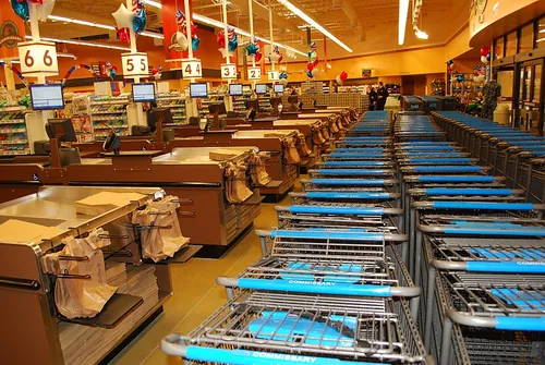 Empty shopping carts and checkout registers wait for commissary patrons hours before the grand opening of new store at Naval Submarine Base